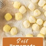 Brown and white text overlay on beige paper with raw potato gnocchi.