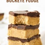Pieces of peanut butter chocolate fudge stacked on a white surface. Brown and red text overlay.