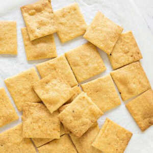 Close up cheese crackers on a white marbled surface. Top view.