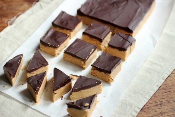 On light colored cloth and paper, squares of peanut butter fudge topped with chocolate