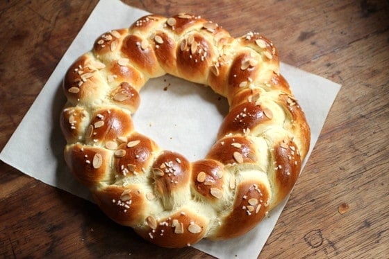 Whole Pulla braid on parchment paper and wooden table