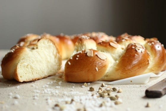 Cut Pulla braid on table with cardamom pods