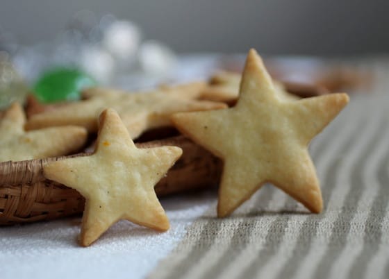 Two star shaped crackers standing on stripped cloth.