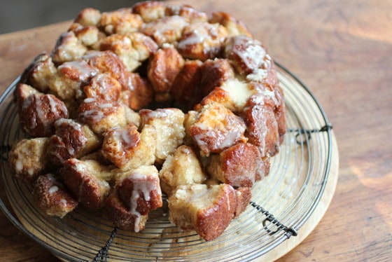 Caramelized Monkey Bread on a wire rack on a wooden table. 