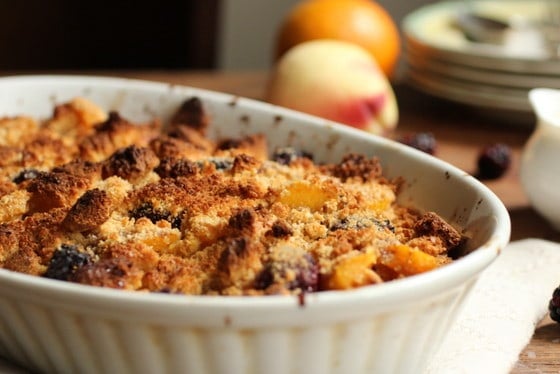 Peach Blackberry Brown Betty in oval ceramic dish.