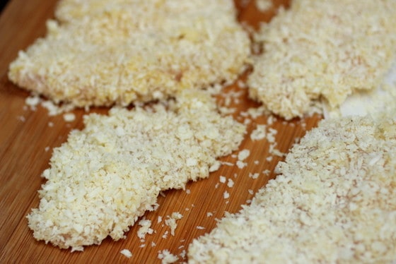 Panko-crusted chicken pieces on wooden board