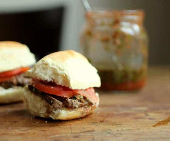 Marinated Steak and Chimichurri Sliders, wooden table, jar in the back