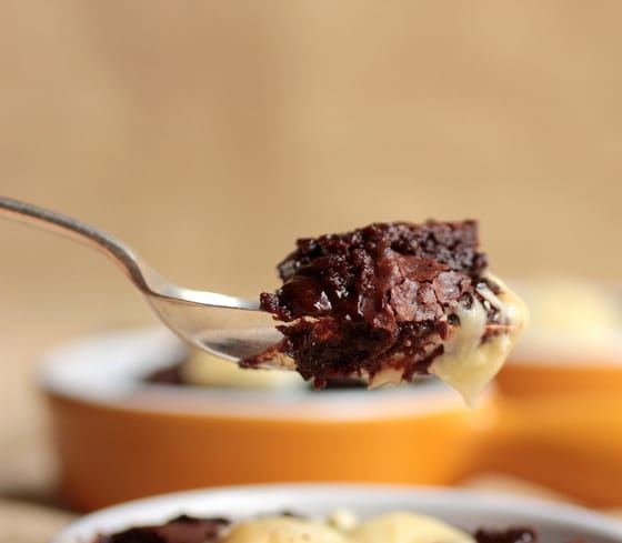 Spoonful of chocolate pudding, blurred yellowish background