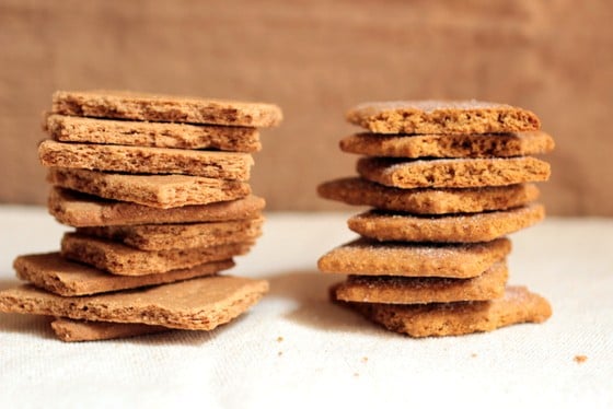 Two stacks of homemade graham crackers on beige and white background