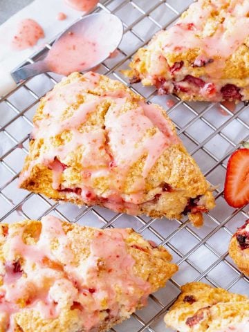 Strawberry scones on wire rack, white background