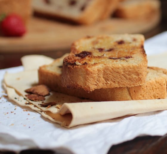 Two toasted slices of bread on beige napkin