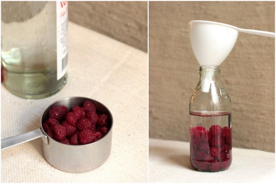 Making raspberry liqueur with vodka and a funnel