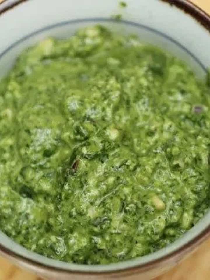 Spinach pesto in a grey bowl.