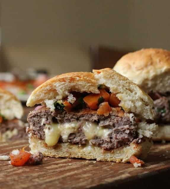 Skillet Blue Cheese Burger on a wooden board, melting cheese