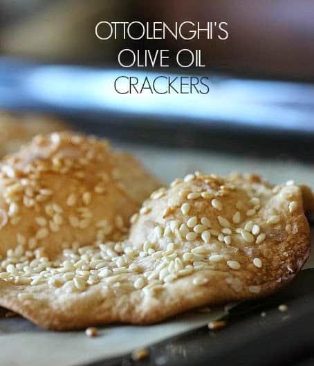 Sesame cracker on bluish background, white text overlay