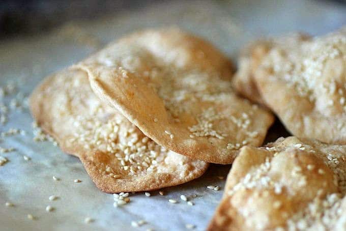Several Olive Oil Crackers on parchment paper