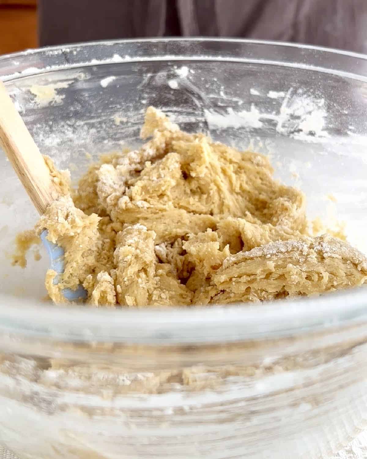 Close up of glass bowl with blondies dough.