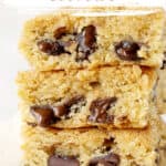 Pink, brown and white text overlay on stack of chocolate chip blondies.