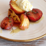 Honey Stone Fruit on white plate, cream on top