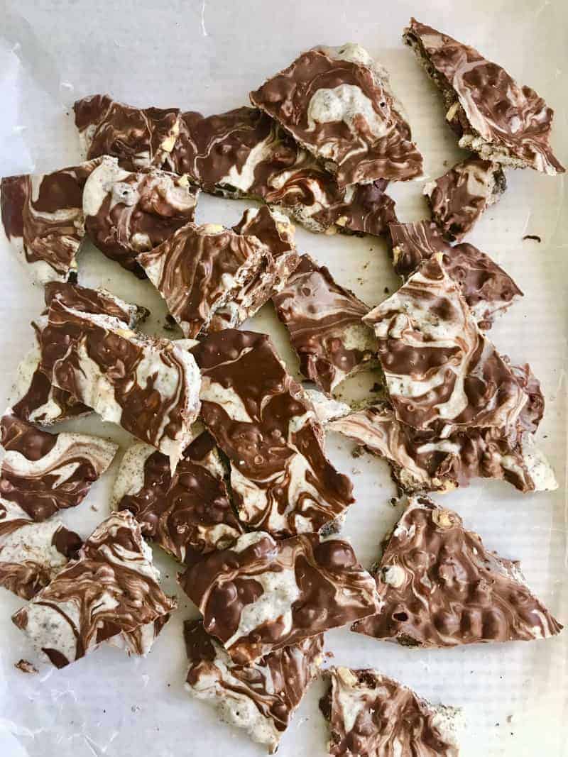 Tray of pieces of White and dark chocolate cookie bark.
