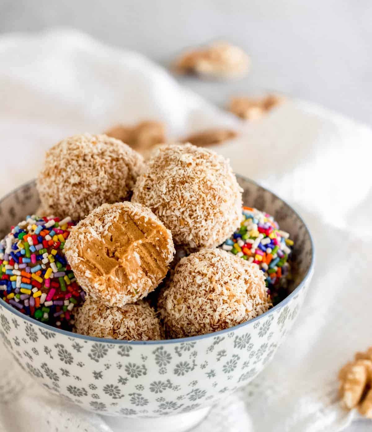 Dulce de leche fudge balls in grey bowl, white cloth.