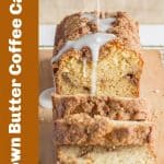 White brown text on the side of sliced loaf cake with glaze
