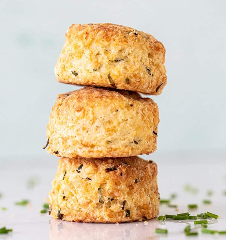 Close up of three scones stacked with a light colored background