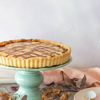 Whole Coconut lemon tart on a cake stand