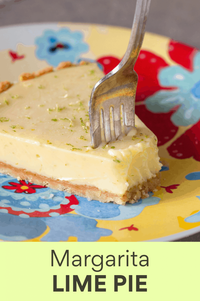 Slice of lime pie on a colorful plate with fork; image with text