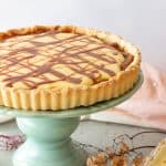 Coconut lemon tart with dulce de leche on a cake stand