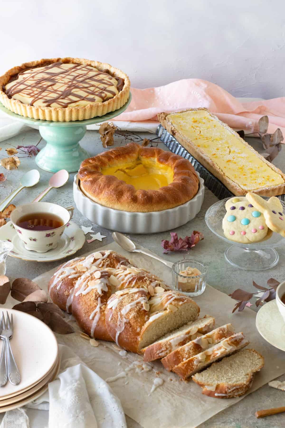 A table with Easter baking recipes, a cup of tea.