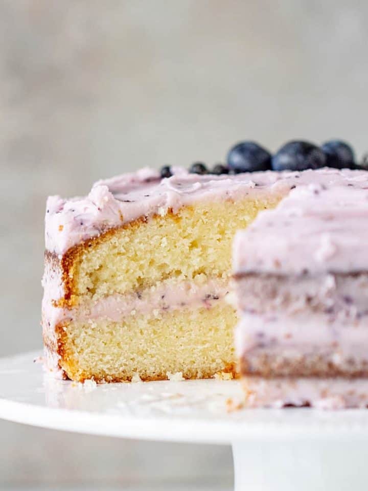 Cut Lemon Blueberry Cake on cake stand