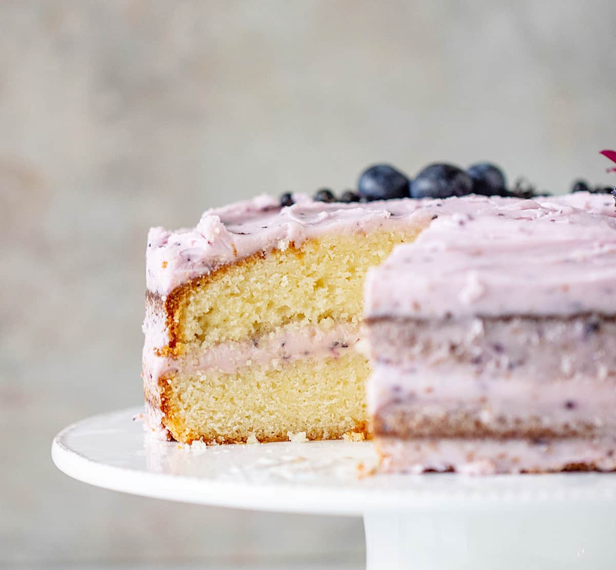Cut Lemon Blueberry Cake on cake stand