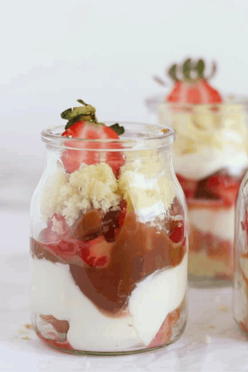 Close-up of strawberry trifle in glass jar