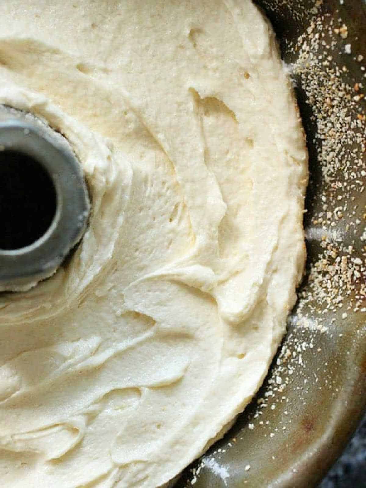 Partial image of Brown Butter Cake batter in bundt pan.