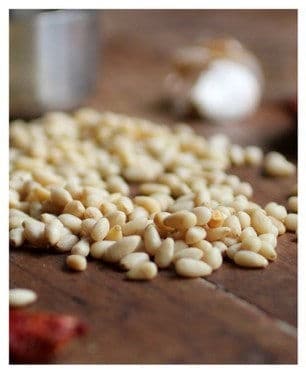 Pine nuts on a wooden table