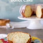 Two slices of poppy seed cake on colorful plate, grey surface, cake on wooden plate