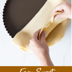 Hands lining pan with sweet shortcrust pastry