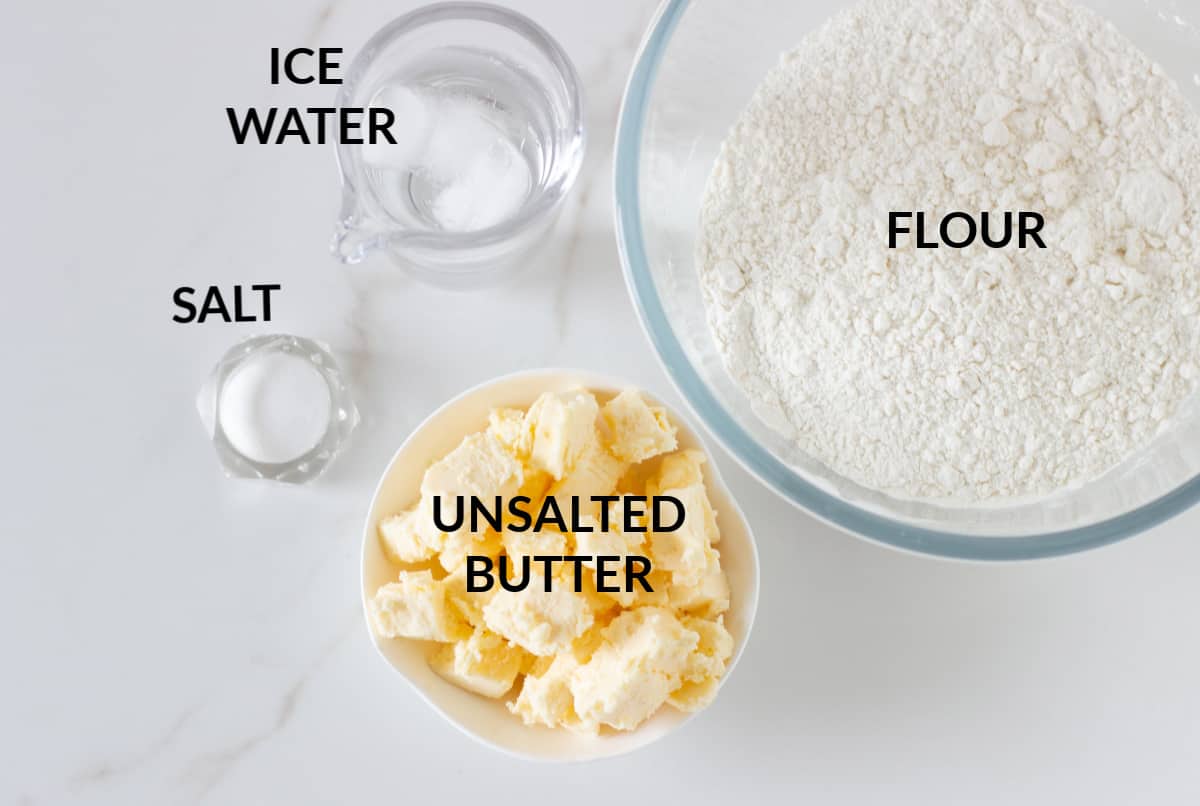 Basic shortcrust pastry ingredients in bowl on white surface