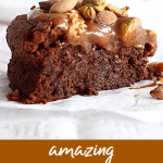 Slice of flourless chocolate cake topped with nuts, long pin with text