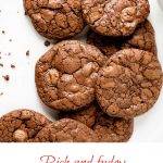 White marble with pile of brownie cookies. Brown and pink text overlay.