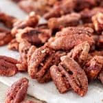 Bunch of cocktail pecans on white napkin