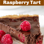 Slice of chocolate raspberry tart on white plate, pin with text