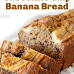 Loaf of banana bread on white paper, cut slices, pin with text