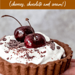 Chocolate cream tart, cherries on top, image with text