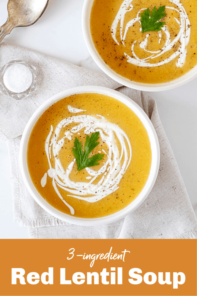 Two white bowls with pumpkin soup, spoons, salt, white background, pin with text