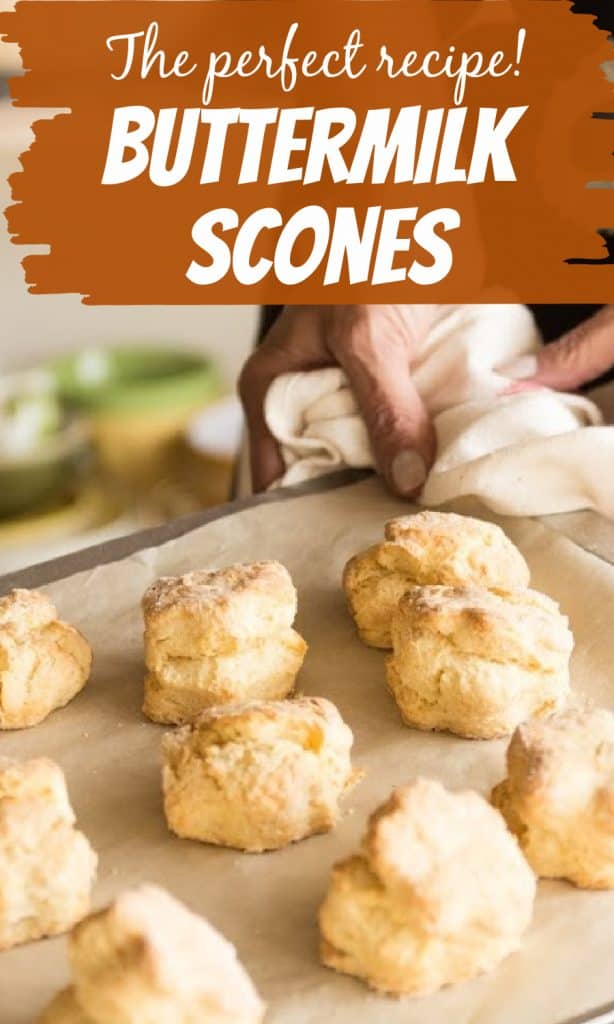 Hand holding kitchen towel and tray with baked scones, image with text