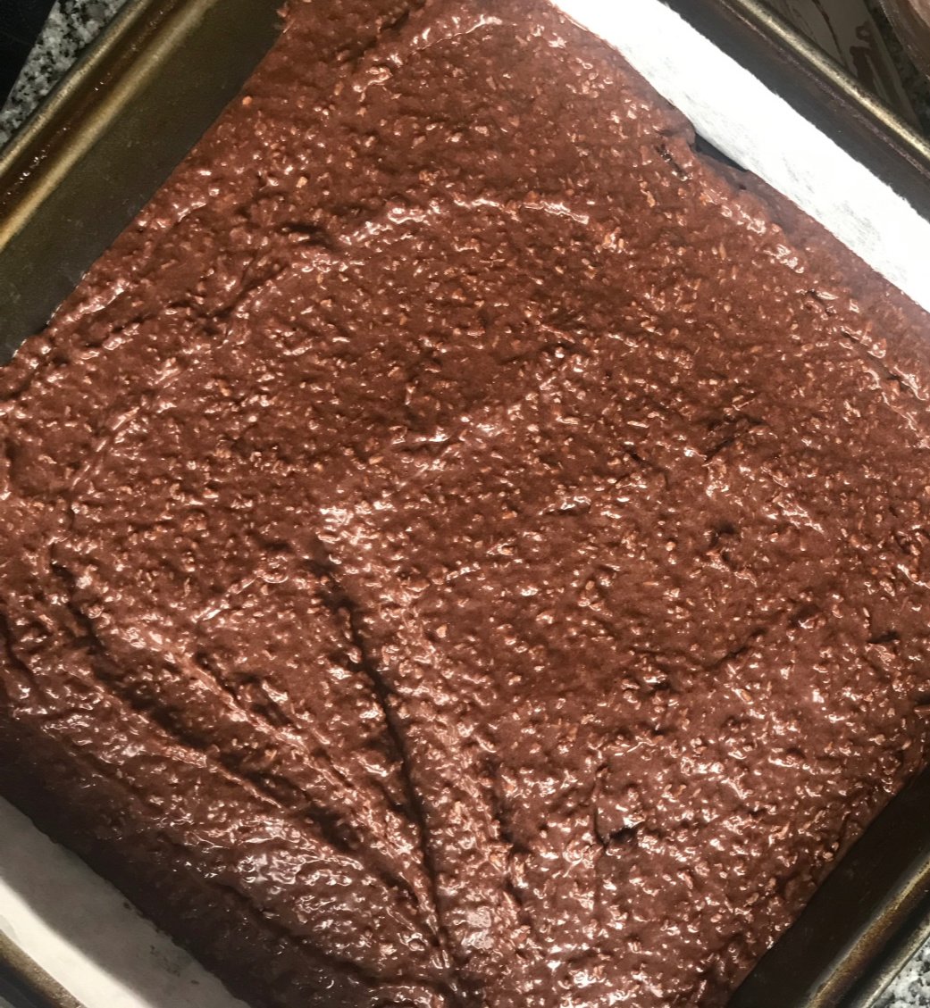 Metal square pan with chocolate batter