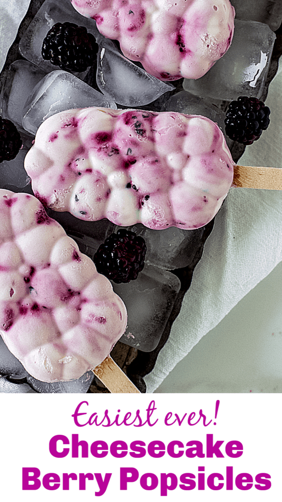 Overview of berry ice cream popsicles on metal pan with ice cubes; image with text