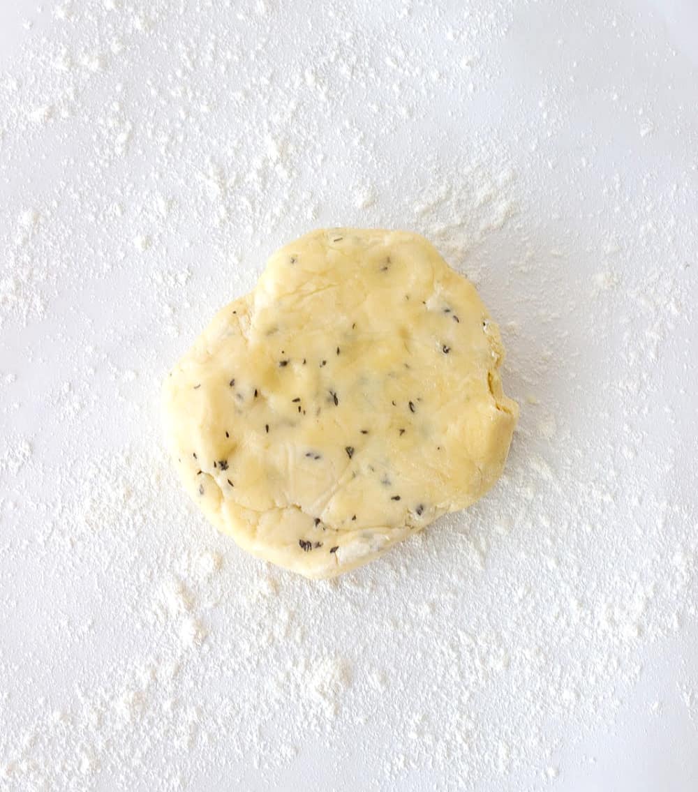 round of pie dough on white surface